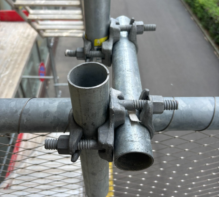 Conventional tube-and-clamp scaffolding joints